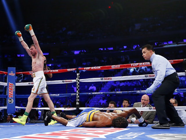 Andy Lee of Ireland raises his arms after knocking out John Jackson of theVirgin Islands in the fifth round of their NABF Super Welterweight title fight on June 7, 2014