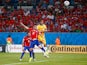  Tim Cahill of Australia goes up for a header against Gary Medel of Chile and scores a goal during the 2014 FIFA World Cup Brazil Group B match between Chile and Australia at Arena Pantanal on June 13, 2014 