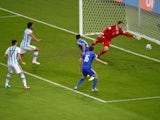 Sead Kolasinac of Bosnia and Herzegovina scores an own goal past goalkeeper Asmir Begovic as Ezequiel Garay and Federico Fernandez of Argentina look on during the 2014 FIFA World Cup Brazil Group F match between Argentina and Bosnia-Herzegovina at Maracan