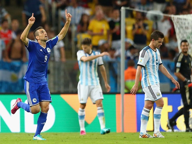 Vedad Ibisevic Bosnia and Herzegovina celebrates scoring his team's first goal during the 2014 FIFA World Cup Brazil Group F match between Argentina and Bosnia-Herzegovina at Maracana on June 15, 2014