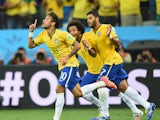 Neymar of Brazil celebrates scoring a first half goal with Marcelo and Hulk during the 2014 FIFA World Cup Brazil Group A match between Brazil and Croatia at Arena de Sao Paulo on June 12, 2014