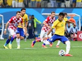 Neymar of Brazil takes a penalty kick in the second half during the 2014 FIFA World Cup Brazil Group A match between Brazil and Croatia at Arena de Sao Paulo on June 12, 2014