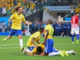 David Luiz of Brazil celebrates with teammates after a goal by Oscar in the second half during the 2014 FIFA World Cup Brazil Group A match between Brazil and Croatia at Arena de Sao Paulo on June 12, 2014