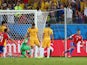 Alexis Sanchez of Chile celebrates after scoring his teams first goal against goalkeeper Mathew Ryan of Australia during the 2014 FIFA World Cup Brazil Group B match between Chile and Australia at Arena Pantanal on June 13, 2014
