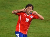 Jorge Valdivia of Chile celebrates after scoring the teams second goal during the 2014 FIFA World Cup Brazil Group B match between Chile and Australia at Arena Pantanal on June 13, 2014