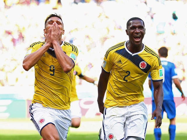 Teofilo Gutierrez of Colombia and Cristian Zapata celebrate after the second goal during the 2014 FIFA World Cup Brazil Group C match between Colombia and Greece at Estadio Mineirao on June 14, 2014
