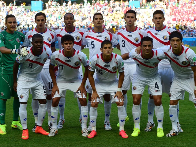 Costa Rica players line up for a photo before a Group D football match between Uruguay and Costa Rica at the Castelao Stadium in Fortaleza during the 2014 FIFA World Cup on June 14, 2014