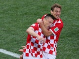 Ivica Olic and Nikica Jelavic of Croatia celebrate after a first half goal during the 2014 FIFA World Cup Brazil Group A match between Brazil and Croatia at Arena de Sao Paulo on June 12, 2014