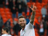 David Edgar of Burnley celebrates at full time of the Sky Bet Championship match between Blackpool and Burnley at Bloomfield Road on April 18, 2014