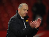 Reading Caretaker Manager Eamonn Dolan applauds the fans at the end of the Barclays Premier League match between Manchester United and Reading at Old Trafford on March 16, 2013