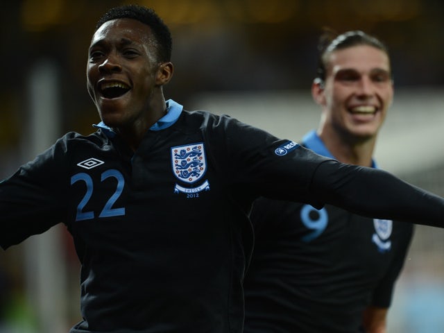 English forward Dany Welbeck celebrates with Andy Carroll after scoring a goal during the Euro 2012 championships football match Sweden vs England on June 15, 2012