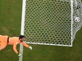 Italy's goalkeeper Salvatore Sirigu jumps to save a goal during a Group D football match between England and Italy at the Amazonia Arena in Manaus during the 2014 FIFA World Cup on June 14, 2014