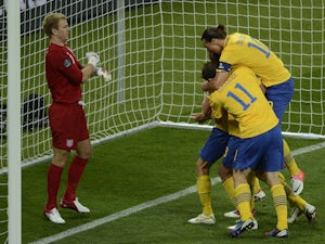 Swedish players celebrate after scoring during the Euro 2012 championships football match Sweden vs England on June 15, 2012