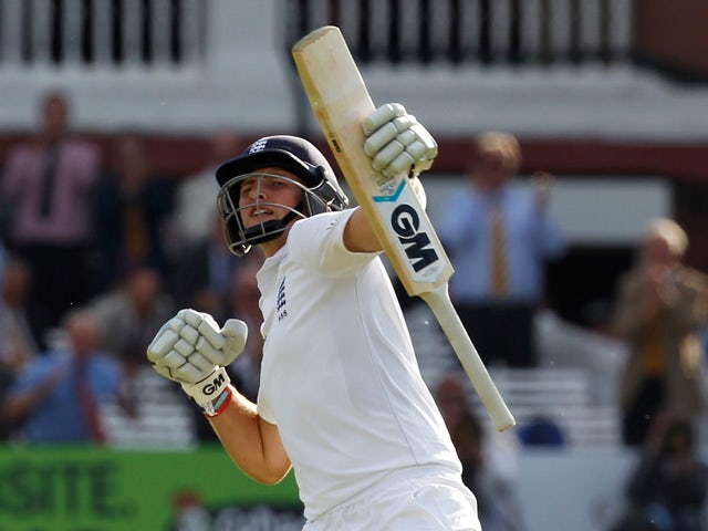 Englands Joe Root celebrates reaching a century not out during play on the first day of the first cricket Test match between England and Sri Lanka at Lord's cricket ground in London on June 12, 2014
