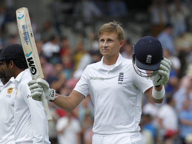 Englands Joe Root acknowledges the crowd after finishing the innings on 200 runs not out during the second days play in the first cricket Test match between England and Sri Lanka at Lord's cricket ground in London on June 13, 2014