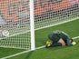 England's goalkeeper Robert Green reacts after missing a goal during their Group C first round 2010 World Cup football match on June 12, 2010
