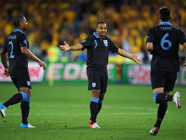  Theo Walcott of England celebrates scoring their second goal during the UEFA EURO 2012 group D match between Sweden and England at The Olympic Stadium on June 15, 2012
