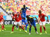 Ecuador's Enner Valencia heads home the opening goal in their World Cup Group E match against Switzerland in Brasilia on June 15, 2014