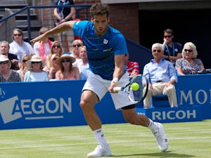 Spain's Feliciano Lopez returns against Australia's Lleyton Hewitt during their second round match on the third day of the ATP Aegon Championships tennis tournament at The Queen's Club in west London, on June 11, 2014