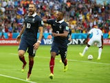 Karim Benzema of France celebrates scoring his team's first goal on a penalty kick with Patrice Evra during the 2014 FIFA World Cup Brazil Group E match between France and Honduras at Estadio Beira-Rio on June 15, 2014