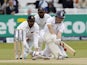 Englands Gary Ballance plays a sweep shot watched by Sri Lankas wicketkeeper Prasanna Jayawardene (L) and Sri Lankas Mahela Jayawardene (C) during play on the fourth day of the first cricket Test match between England and Sri Lanka at Lord's cricket groun