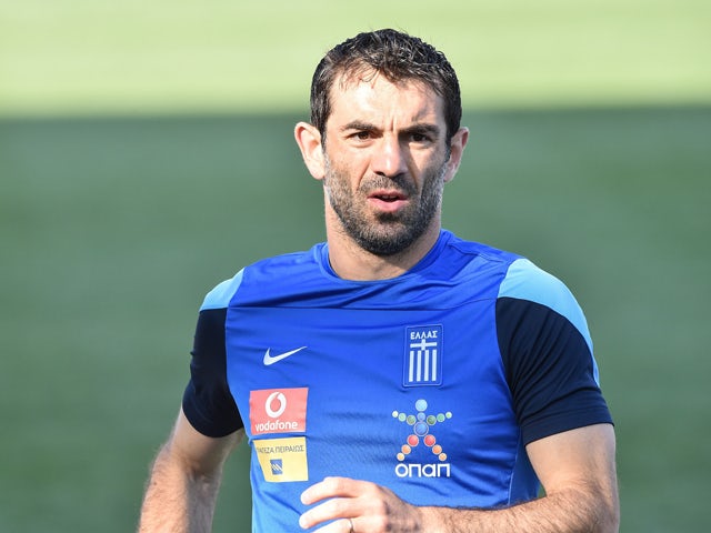 Greek national team midfielder Giorgios Karagounis takes part in a practice session in Chester, Pennsylvania, on June 2, 2014