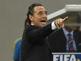 Italy's coach Cesare Prandelli gestures to his players from the sidelines during a Group D football match between England and Italy at the Amazonia Arena in Manaus during the 2014 FIFA World Cup on June 14, 2014