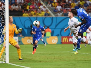 Mario Balotelli of Italy scores his team's second goal on a header past Gary Cahill and goalkeeper Joe Hart of England during the 2014 FIFA World Cup Brazil Group D match between England and Italy at Arena Amazonia on June 14, 2014