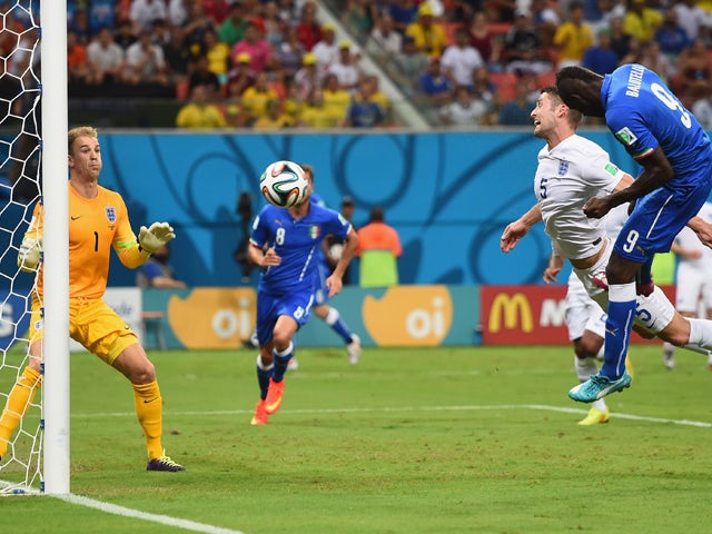 Mario Balotelli of Italy scores his team's second goal on a header past Gary Cahill and goalkeeper Joe Hart of England during the 2014 FIFA World Cup Brazil Group D match between England and Italy at Arena Amazonia on June 14, 2014
