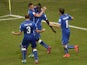Italy's forward Mario Balotelli celebrates with teammates after scoring during a Group D football match between England and Italy at the Amazonia Arena in Manaus during the 2014 FIFA World Cup on June 14, 2014