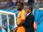 Didier Drogba of the Ivory Coast stands on the sidelines with head coach Sabri Lamouchi during the 2014 FIFA World Cup Brazil Group C match between the Ivory Coast and Japan at Arena Pernambuco on June 14, 2014