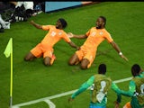 Gervinho of the Ivory Coast celebrates scoring his team's second goal with teammate Didier Drogba during the 2014 FIFA World Cup Brazil Group C match between the Ivory Coast and Japan at Arena Pernambuco on June 14, 2014