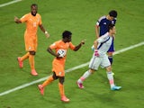 Wilfried Bony of the Ivory Coast celebrates scoring his team's first goal with Didier Drogba as goalkeeper Eiji Kawashima of Japan reacts during the 2014 FIFA World Cup Brazil Group C match between the Ivory Coast and Japan at Arena Pernambuco on June