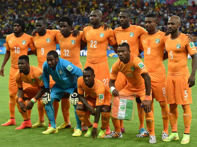 Ivory Coast national team pose prior to the start of a Group C football match between Ivory Coast and Japan at the Pernambuco Arena in Recife during the 2014 FIFA World Cup on June 14, 2014