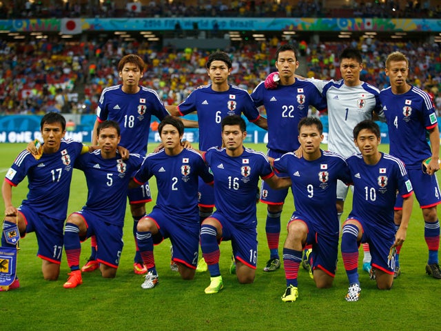 Japan pose for a team photo before the 2014 FIFA World Cup Brazil Group C match between the Ivory Coast and Japan at Arena Pernambuco on June 14, 2014