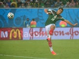 Mexico's forward Javier Hernandez kicks the ball during the Group A football match between Mexico and Cameroon at the Dunas Arena in Natal during the 2014 FIFA World Cup on June 13, 2014