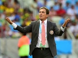 Costa Rica's Colombian coach Jorge Luis Pinto celebrates after Costa Rica's forward Joel Campbell (not seen) scored his team's first goal during a Group D football match between Uruguay and Costa Rica at the Castelao Stadium in Fortaleza during the 2014 F