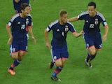 :Japan's forward Keisuke Honda celebrates after scoring during a Group C football match between Ivory Coast and Japan at the Pernambuco Arena in Recife during the 2014 FIFA World Cup on June 14, 2014
