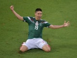 Mexico's forward Oribe Peralta celebrates after scoring a goal during the Group A football match between Mexico and Cameroon at the Dunas Arena in Natal during the 2014 FIFA World Cup on June 13, 2014