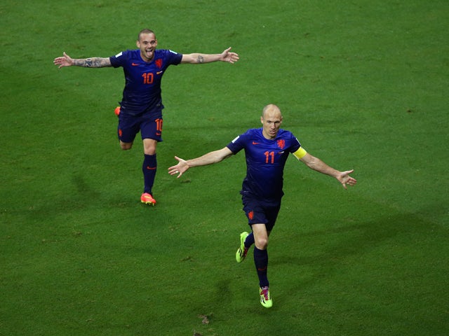  Arjen Robben of the Netherlands celebrates scoring the teams fifth goal with Wesley Sneijder during the 2014 FIFA World Cup Brazil Group B match between Spain and Netherlands at Arena Fonte Nova on June 13, 2014