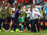 Robin van Persie of the Netherlands celebrates with head coach Louis van Gaal of the Netherlands after scoring the teams first goal in the first half during the 2014 FIFA World Cup Brazil Group B match between Spain and Netherlands at Arena Fonte Nova on 