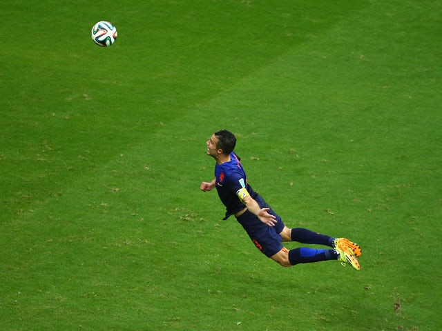 Robin van Persie of the Netherlands scores the teams first goal with a diving header in the first half during the 2014 FIFA World Cup Brazil Group B match between Spain and Netherlands at Arena Fonte Nova on June 13, 2014