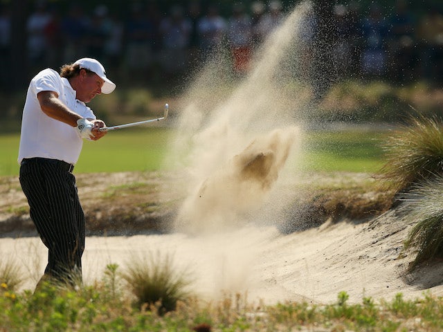 Phil Mickelson of the United States hits a shot from a bunker during a practice round prior to the start of the 114th U.S. Open at Pinehurst Resort & Country Club on June 10, 2014