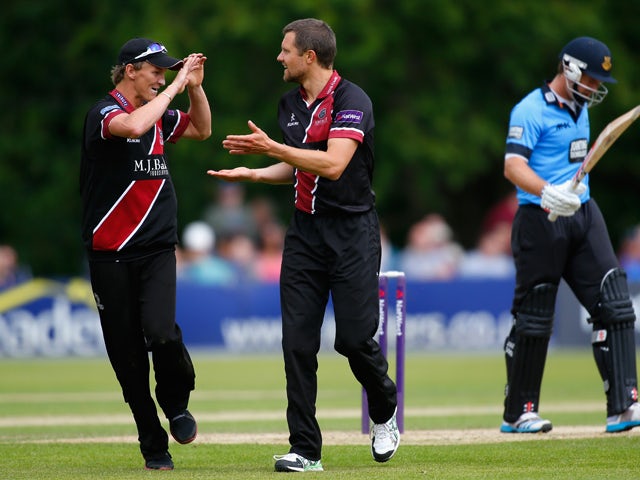 Dirk Nannes of Somerset celebrates with teammate Max Waller after dismissing Chris Nash of Sussex during the Natwest T20 Blast match between Sussex Sharks and Somerset at Arundel Castle on June 15, 2014