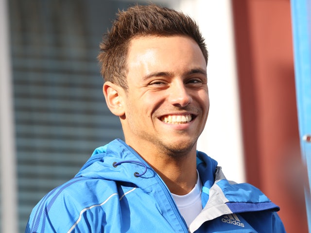 British diver Tom Daley speaks to the media as the Commonwealth Games Baton arrives at St Aubins Harbour on May 11, 2014