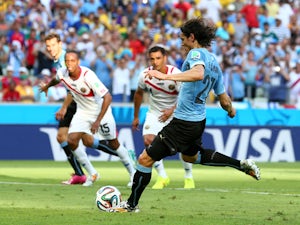  Edinson Cavani of Uruguay shoots and scores his team's first goal on a penalty kick during the 2014 FIFA World Cup Brazil Group D match between Uruguay and Costa Rica at Castelao on June 14, 2014 