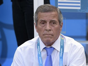 Uruguay's coach Oscar Tabarez sits on the bench during a Group D football match between Uruguay and Costa Rica at the Castelao Stadium in Fortaleza during the 2014 FIFA World Cup on June 14, 2014