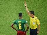 Cameroon's Alex Song is shown a red card during his team's match with Croatia on June 18, 2014.
