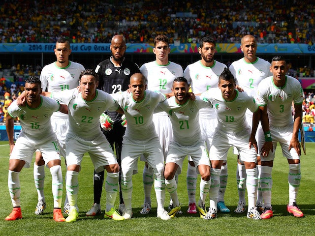 Algeria players pose for a team photo before the 2014 FIFA World Cup Brazil Group H match between Belgium and Algeria at Estadio Mineirao on June 17, 2014