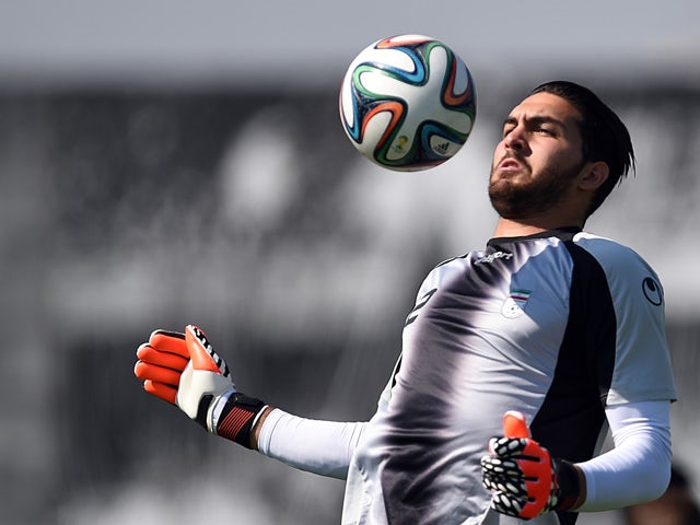 Iran's goalkeeper Alireza Haghighi takes part in a training session at the CT Joaquim Grava training ground in Sao Paulo on June 18, 2014